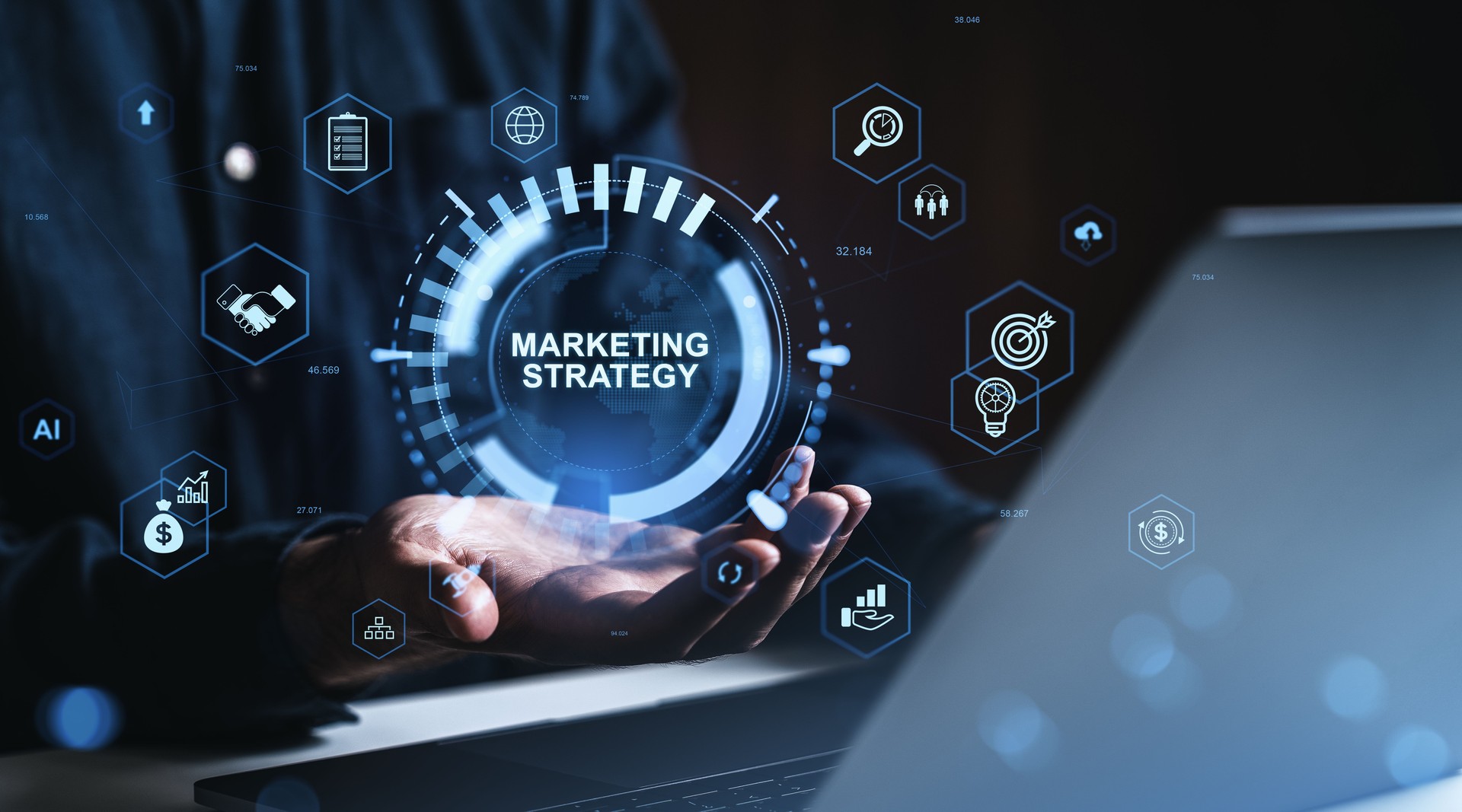 Futuristic marketing strategy concept with digital interface and business icons above open hands in dark environment with blue highlights.